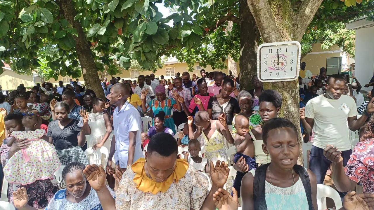 An outdoor prayer gathering led by Miraculous Synagogue Ministries