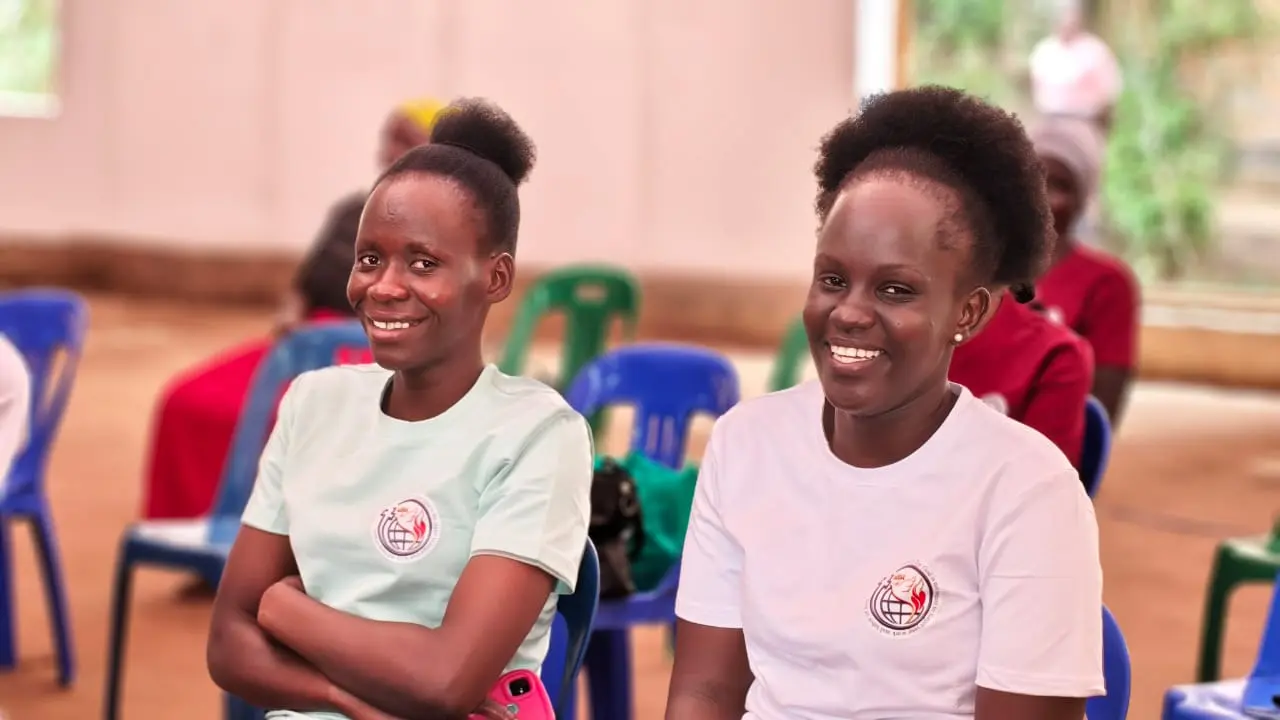 Two young women from Miraculous Synagogue Ministries smiling
